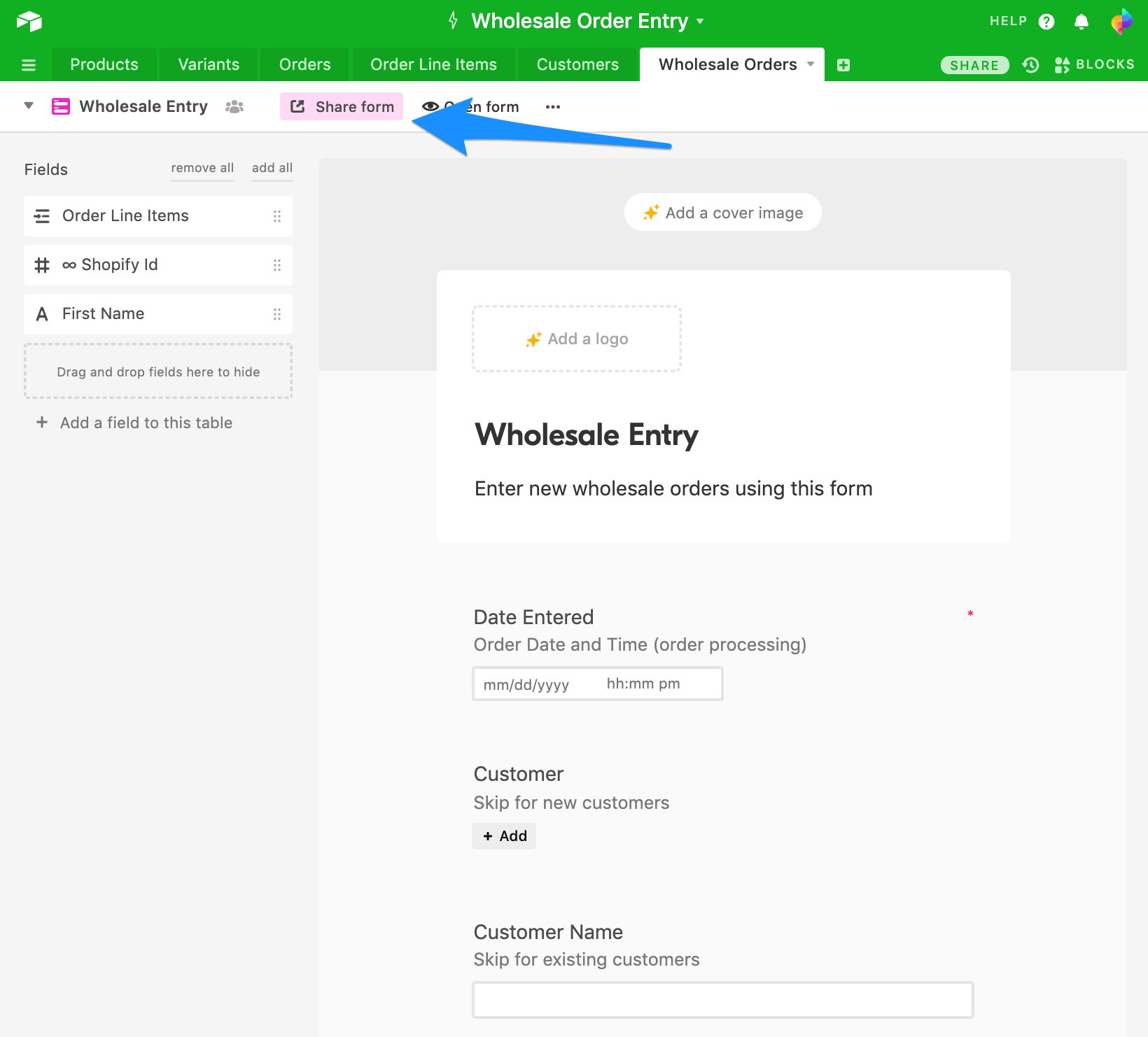 Airtable form builder for Wholesale Entry with a blue arrow pointing to the Share form button