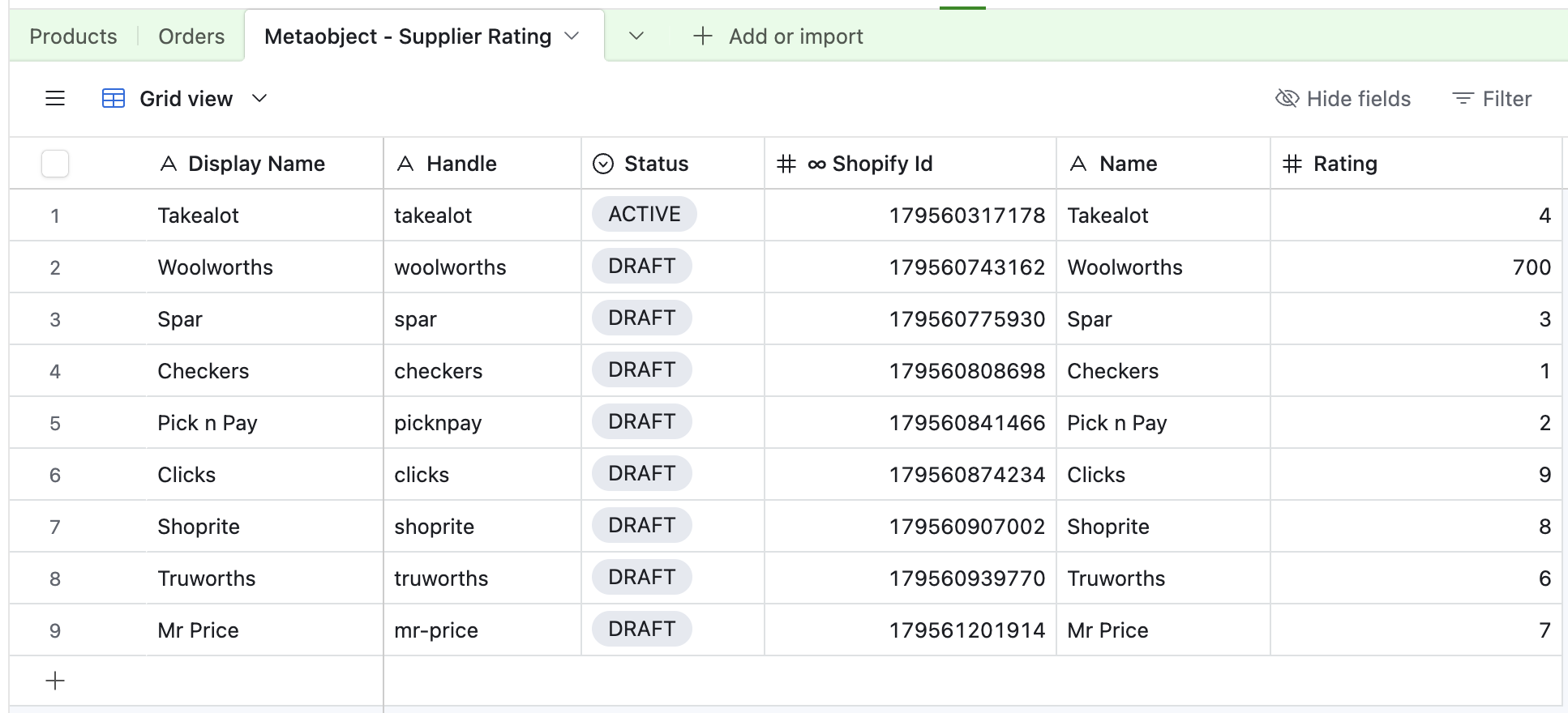 Airtable grid named Metaobject - Supplier Rating with display names, handles, status pills, Shopify IDs, names, and ratings